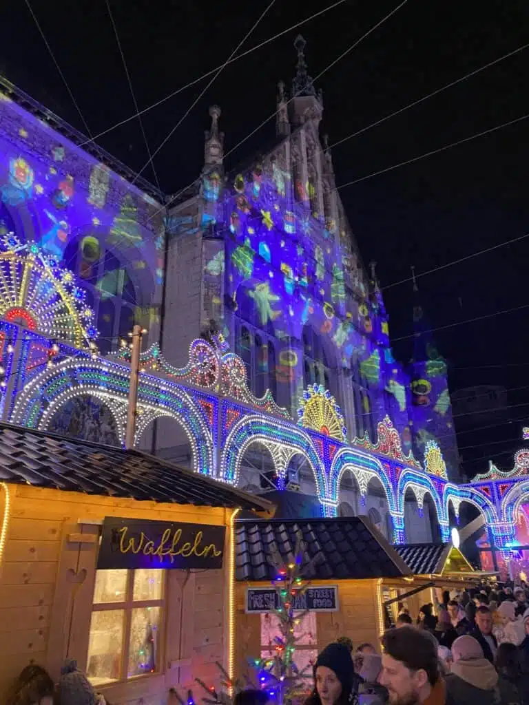 The building illuminated with the light designs at the Illuminarium.