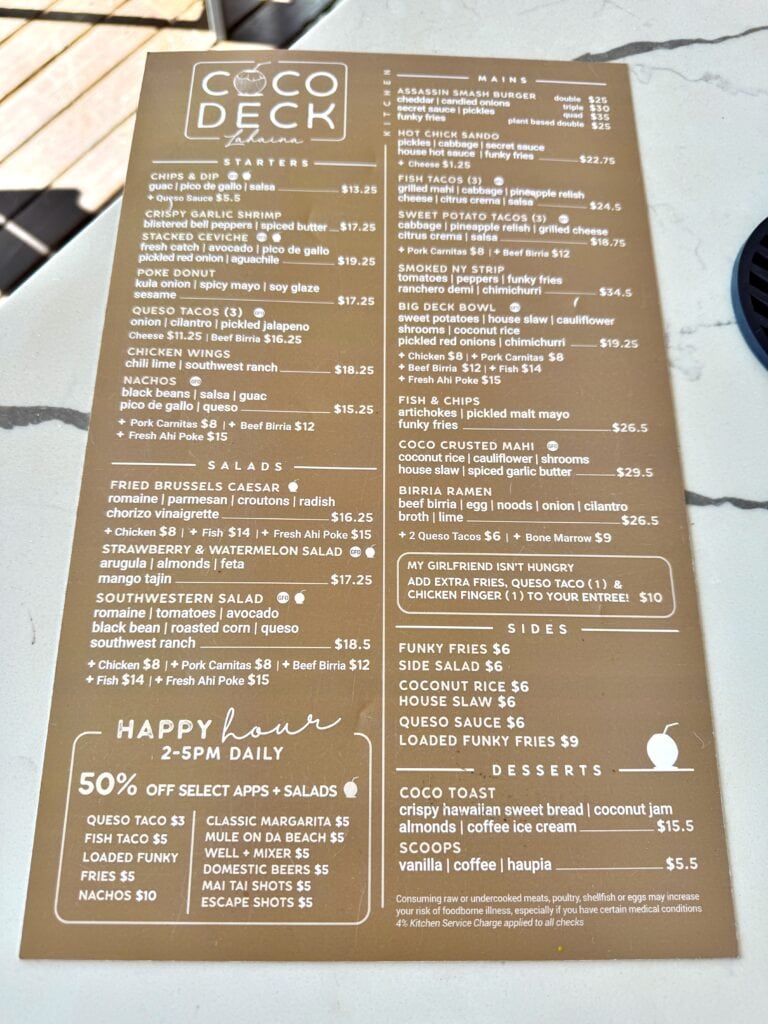 Menu from Coco Decks Eatery, one of the top West Maui Restaurants, featuring sections for salads, tacos, mains, sides, happy hour specials, and desserts on a tan background with white text. Coco Deck is one of the most up and coming Restaurants in West Maui