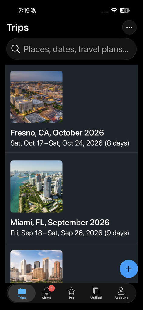 A smartphone screen showing one of the best travel apps for planning, displaying upcoming trips to Fresno, Miami, and another city, including dates and durations.